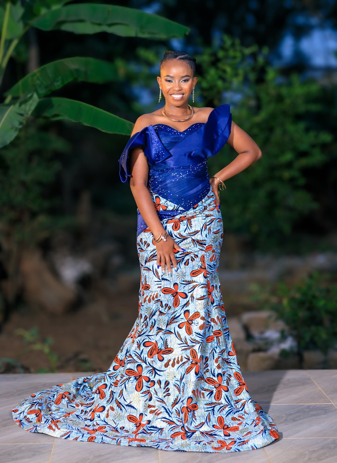 Glory in her blue and orange gown